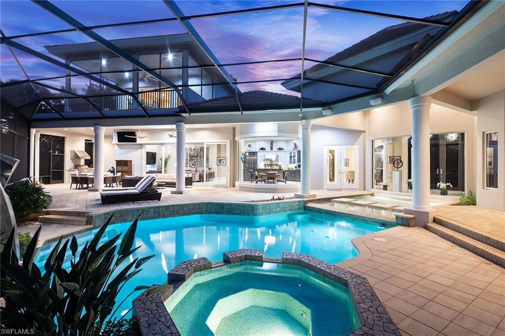 11617 Useppa Court Naples, FL 34110 - Photo 5 of 50 a swimming pool with outdoor seating