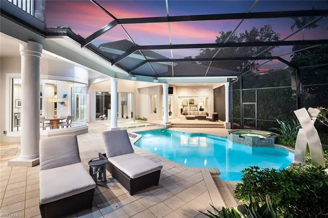 a view of a swimming pool with a patio