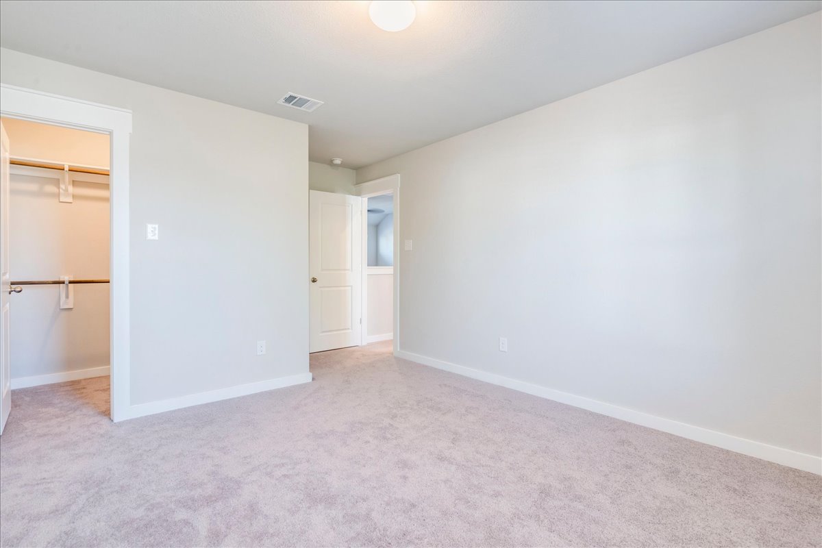 144 Threshing Road, Unit A Buda, TX 78610 - Photo 25 of 35 Bedroom 3