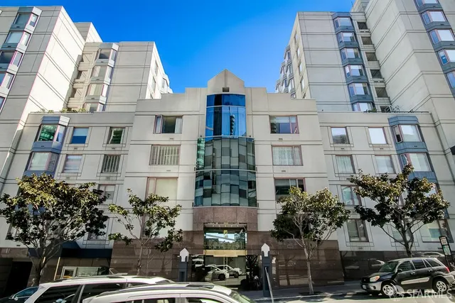 a roof deck with table and chairs