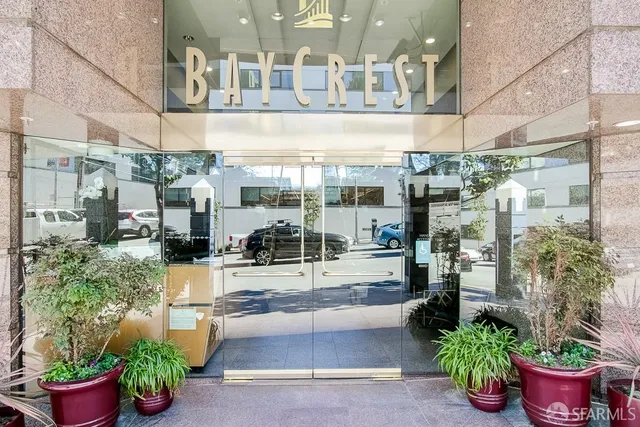 a view of a porch with potted plants