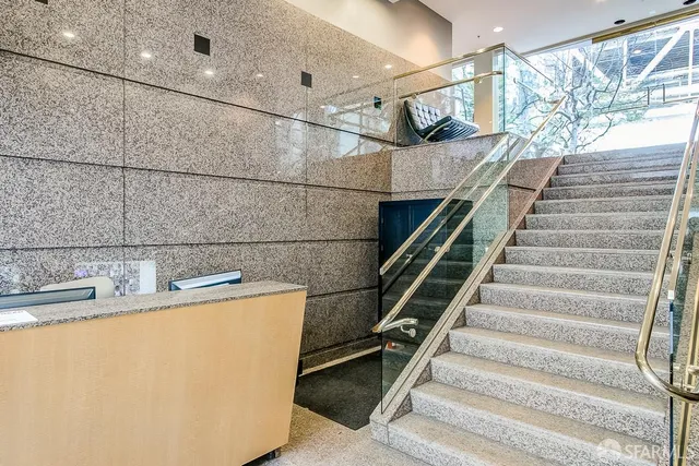a view of entryway and kitchen
