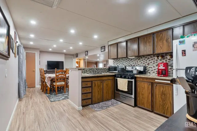 a kitchen with lots of counter top space and appliances