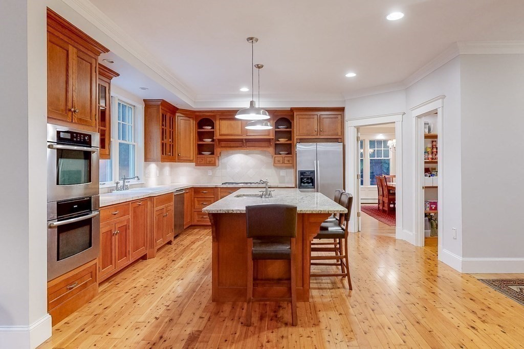 17 Broken Tree Road Medway, MA 02053 - Photo 11 of 40 a kitchen with stainless steel appliances granite countertop a stove and a refrigerator