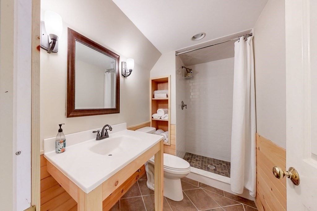 17 Broken Tree Road Medway, MA 02053 - Photo 39 of 40 a bathroom with a sink vanity mirror and toilet