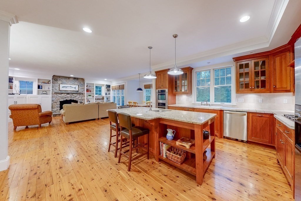 17 Broken Tree Road Medway, MA 02053 - Photo 10 of 40 a kitchen with stainless steel appliances granite countertop a stove and a refrigerator