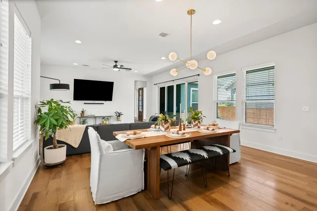 a view of a dining room with furniture window and wooden floor