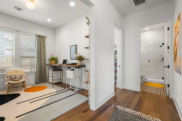 a bedroom with a bed and a view of bathroom