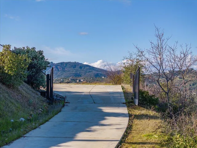 a view of a pathway with a yard