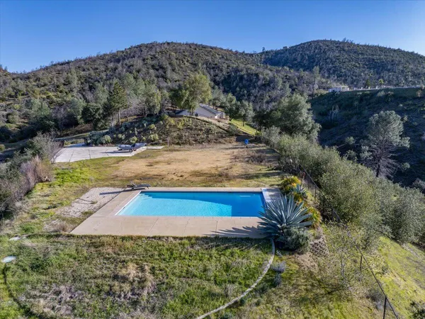 a view of a backyard with a lake view