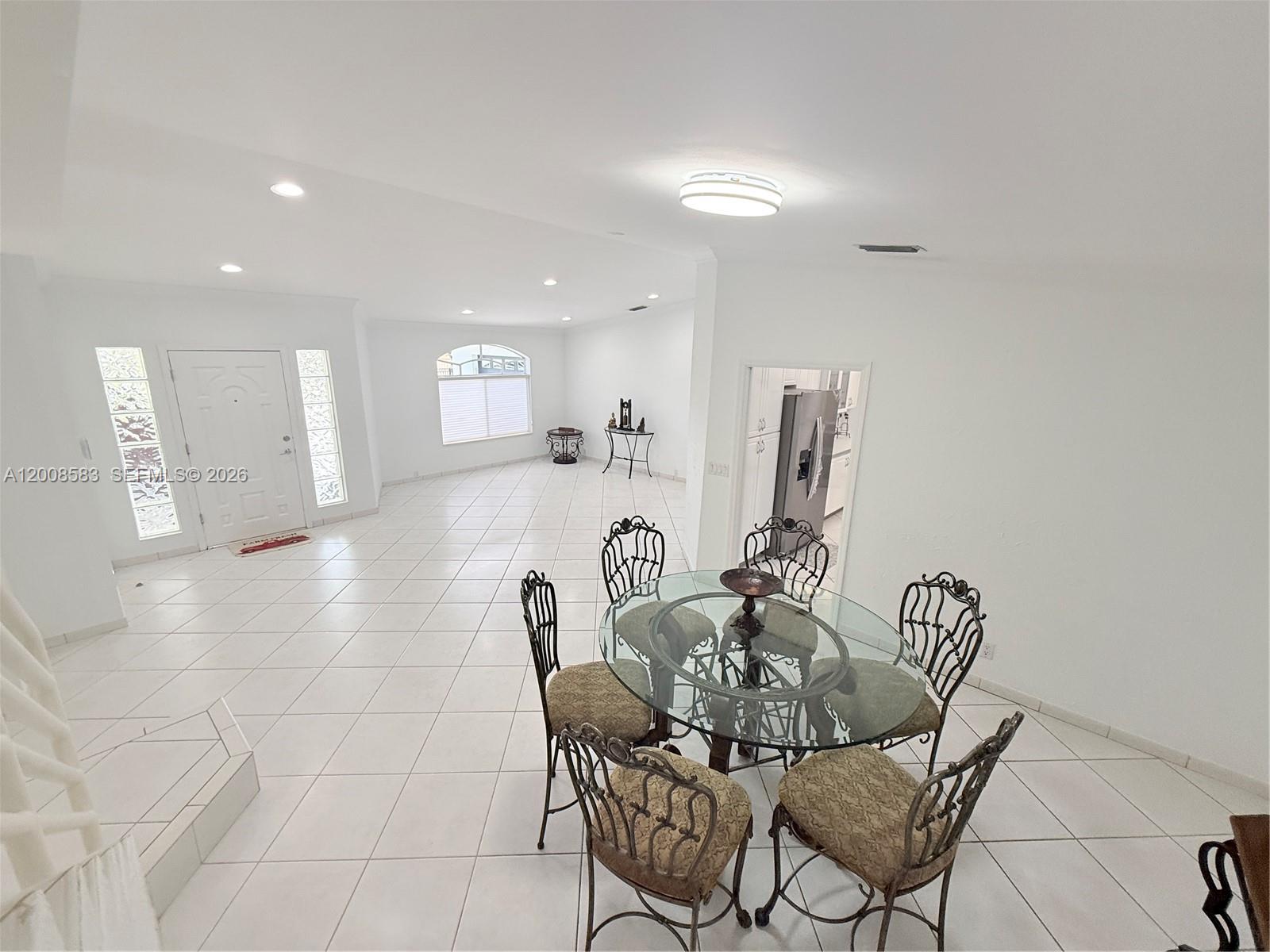 13431 Southwest 32nd Street Miami, FL 33165 - Photo 11 of 77 a dining room with furniture and wooden floor