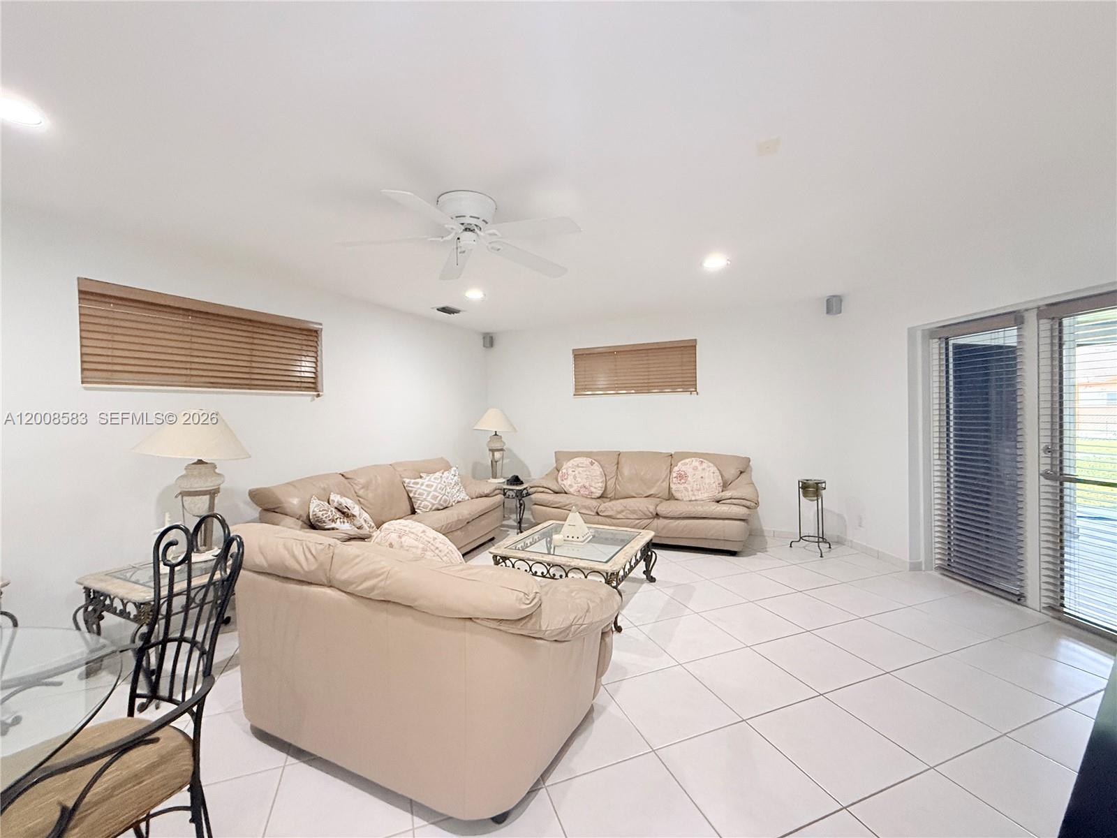 13431 Southwest 32nd Street Miami, FL 33165 - Photo 16 of 77 a living room with furniture and a table