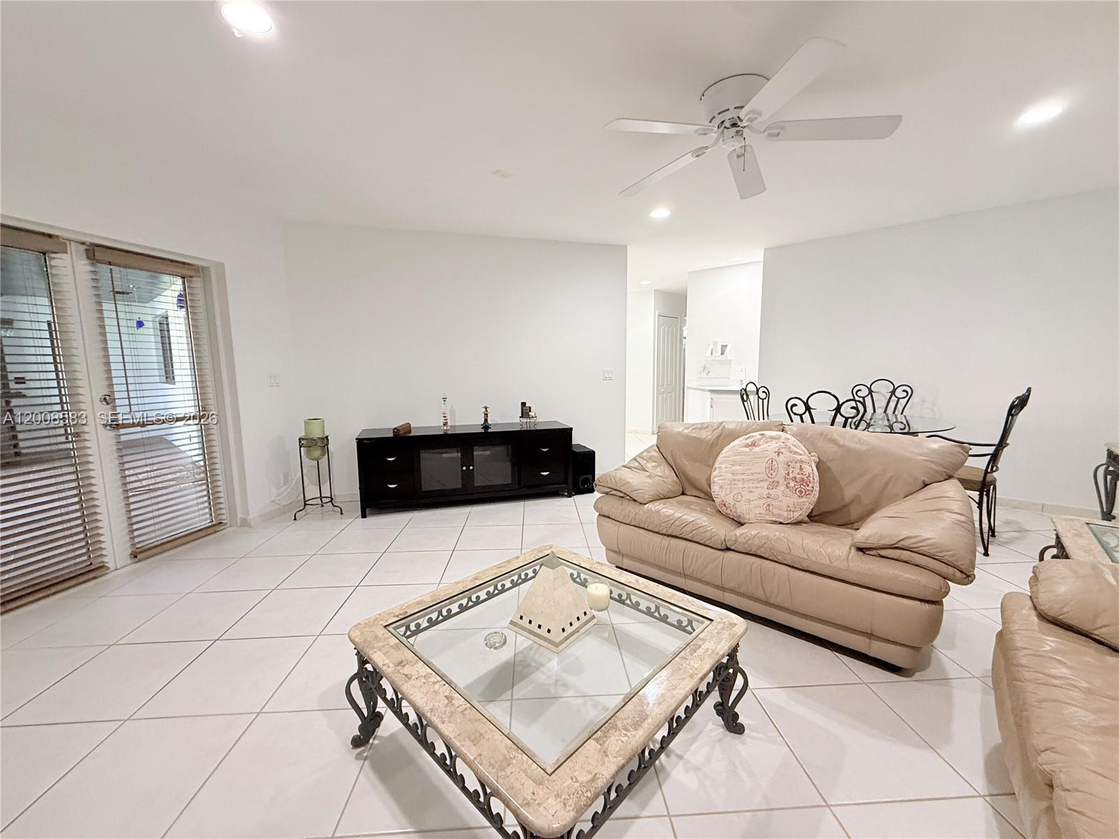 13431 Southwest 32nd Street Miami, FL 33165 - Photo 17 of 77 a living room with furniture and a couch