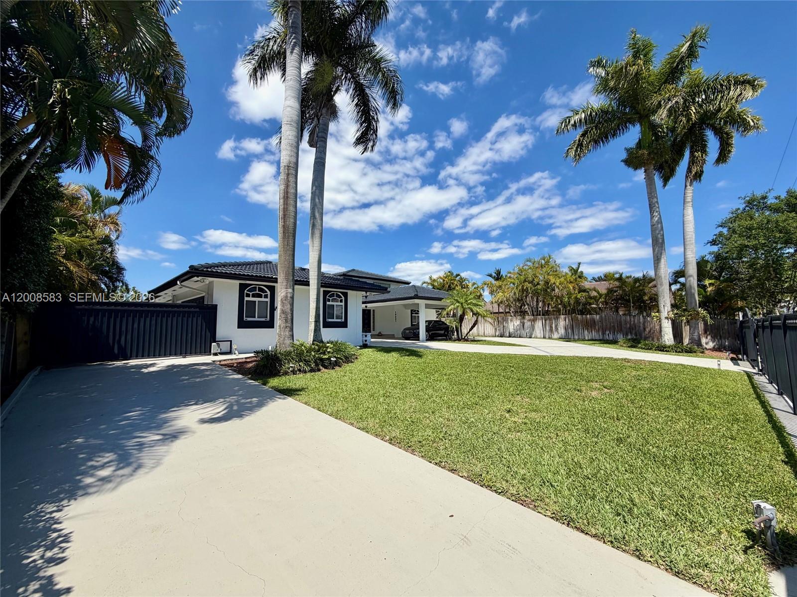 13431 Southwest 32nd Street Miami, FL 33165 - Photo 2 of 77 side driveway to back garages