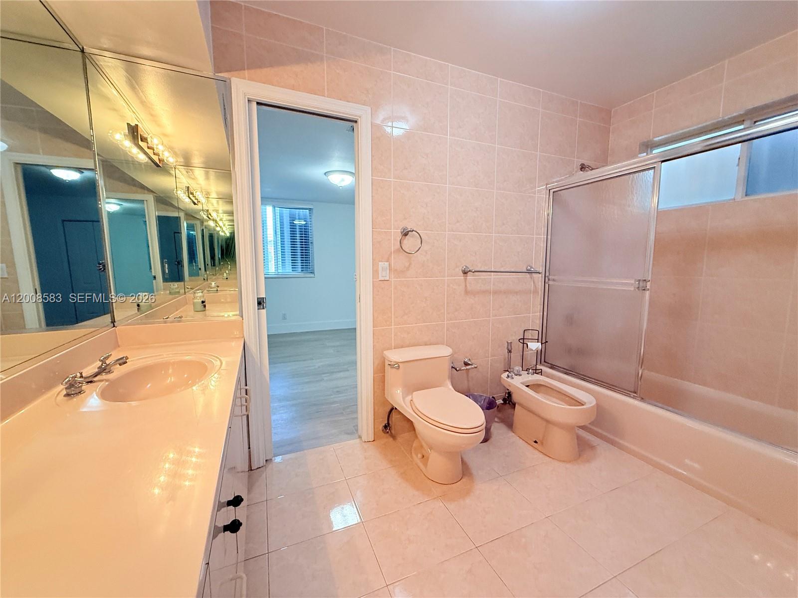 13431 Southwest 32nd Street Miami, FL 33165 - Photo 26 of 77 a bathroom with a sink a toilet and shower