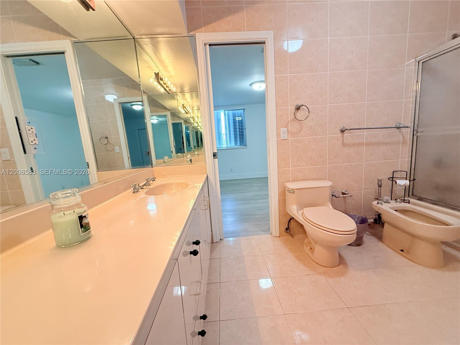 13431 Southwest 32nd Street Miami, FL 33165 - Photo 27 of 77 a bathroom with a sink a toilet and shower