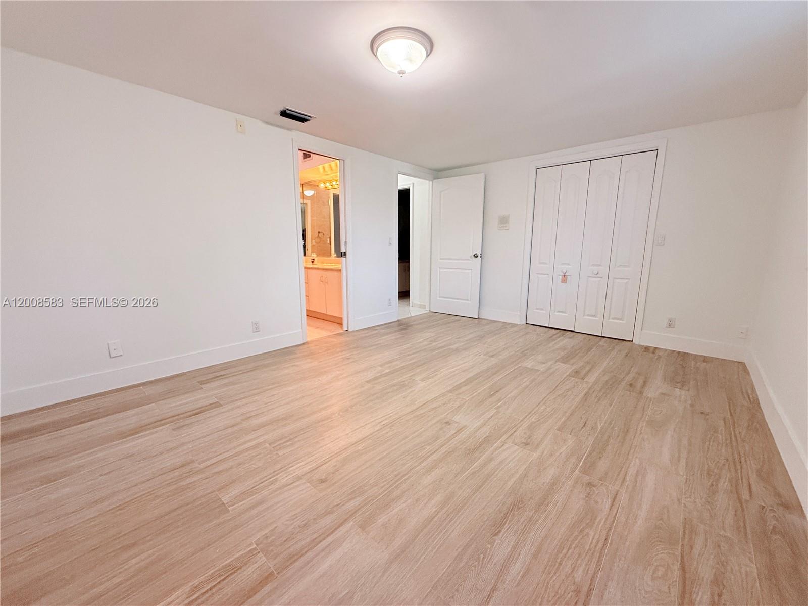 13431 Southwest 32nd Street Miami, FL 33165 - Photo 30 of 77 a view of an empty room and wooden floor