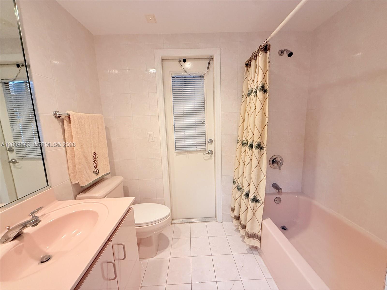 13431 Southwest 32nd Street Miami, FL 33165 - Photo 32 of 77 a bathroom with a sink a toilet and shower