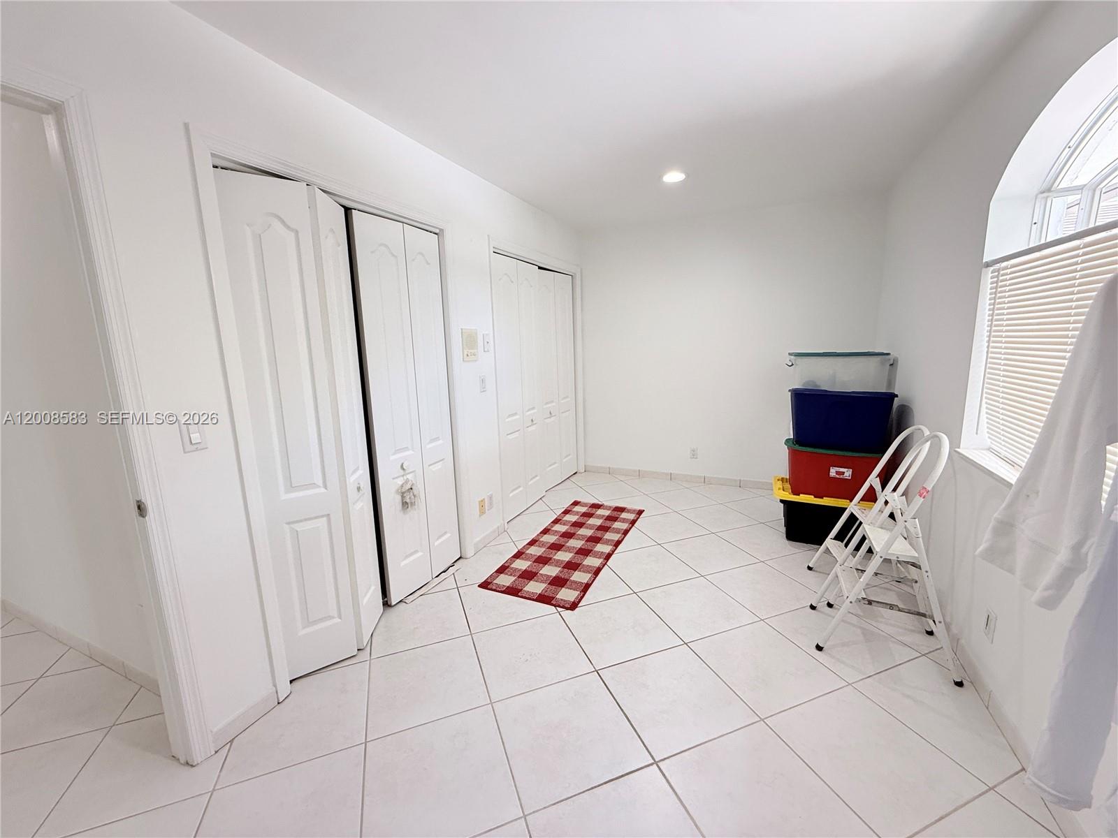 13431 Southwest 32nd Street Miami, FL 33165 - Photo 35 of 77 a room with washing machine and air hockey table