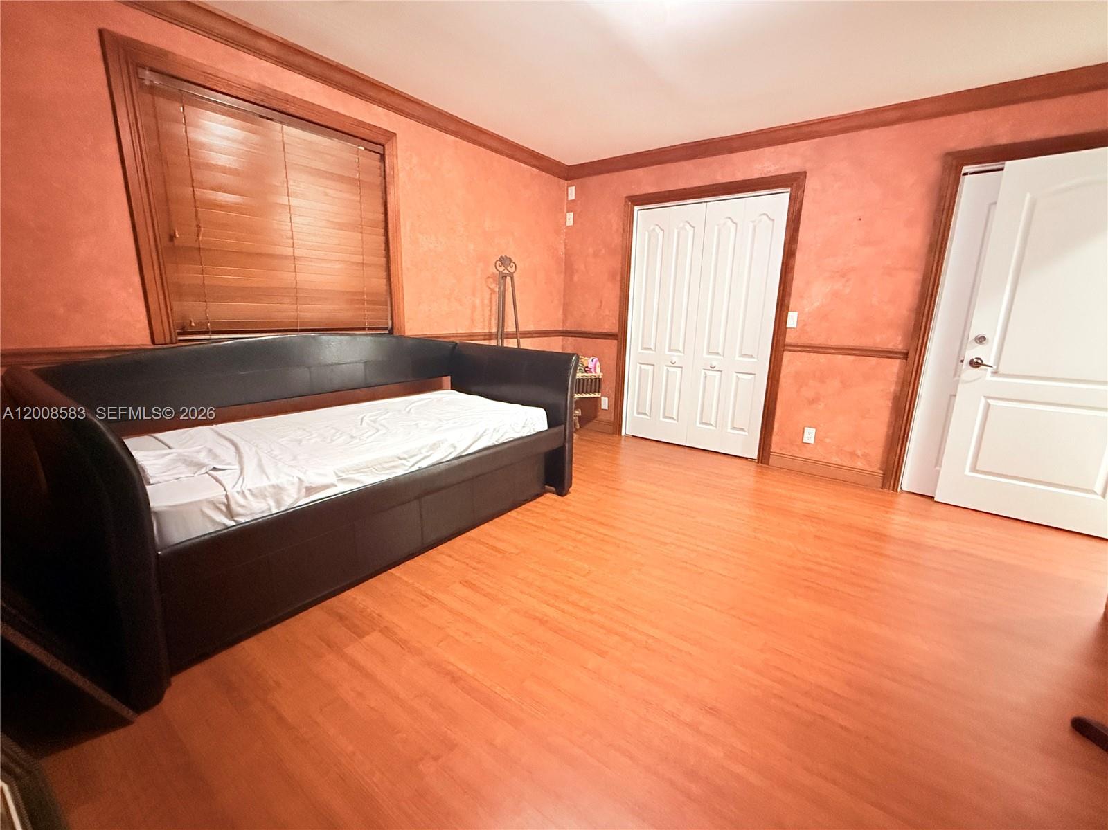 13431 Southwest 32nd Street Miami, FL 33165 - Photo 37 of 77 a bedroom with a bed and a window