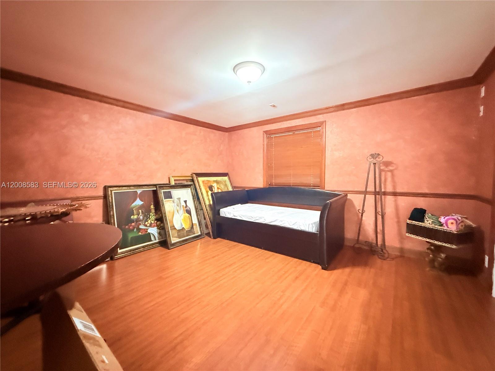 13431 Southwest 32nd Street Miami, FL 33165 - Photo 38 of 77 a bedroom with a bed and glass walk in closet
