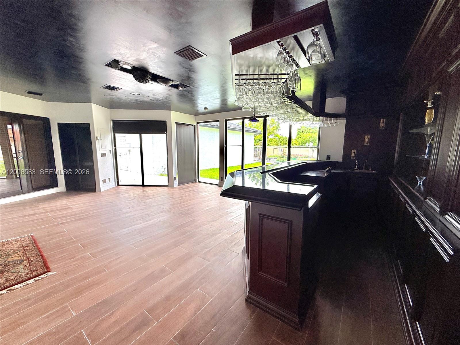 13431 Southwest 32nd Street Miami, FL 33165 - Photo 41 of 77 a view of an entryway with wooden floor