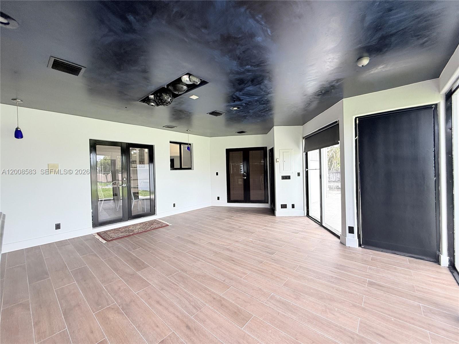 13431 Southwest 32nd Street Miami, FL 33165 - Photo 44 of 77 a view of an empty room with window and cabinet