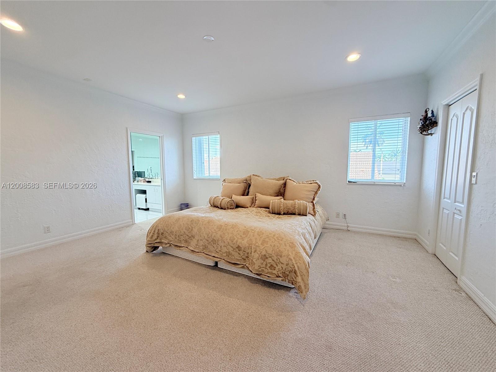 13431 Southwest 32nd Street Miami, FL 33165 - Photo 49 of 77 a bedroom with a bed and a window