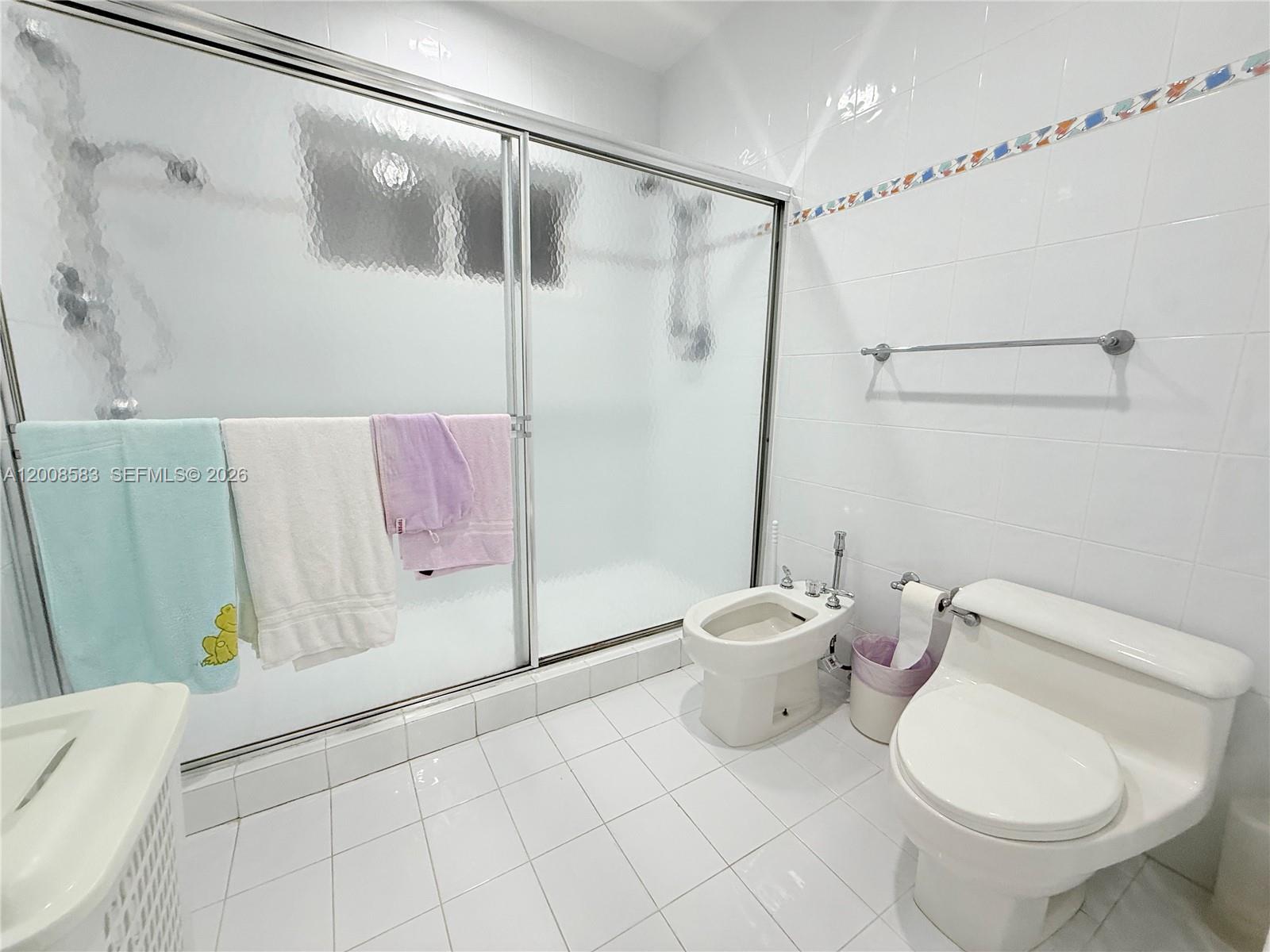 13431 Southwest 32nd Street Miami, FL 33165 - Photo 54 of 77 a bathroom with a toilet and a shower