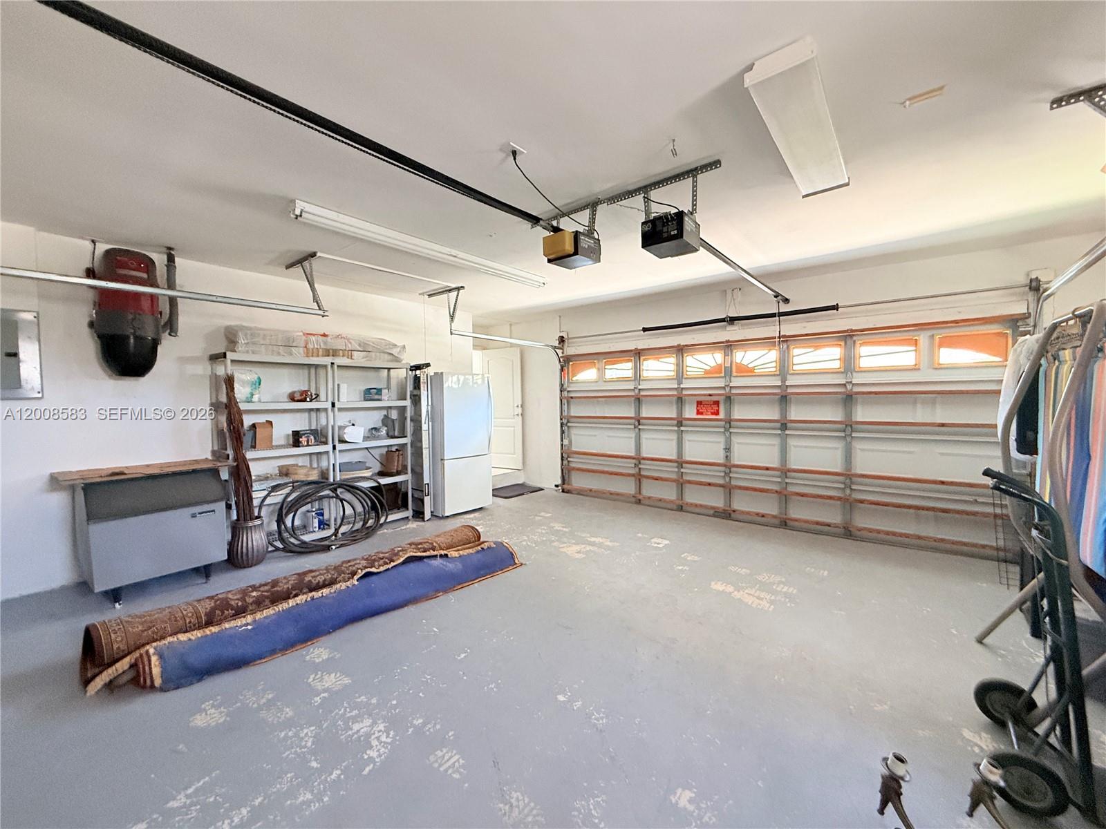 13431 Southwest 32nd Street Miami, FL 33165 - Photo 59 of 77 a view of a room with gym equipment