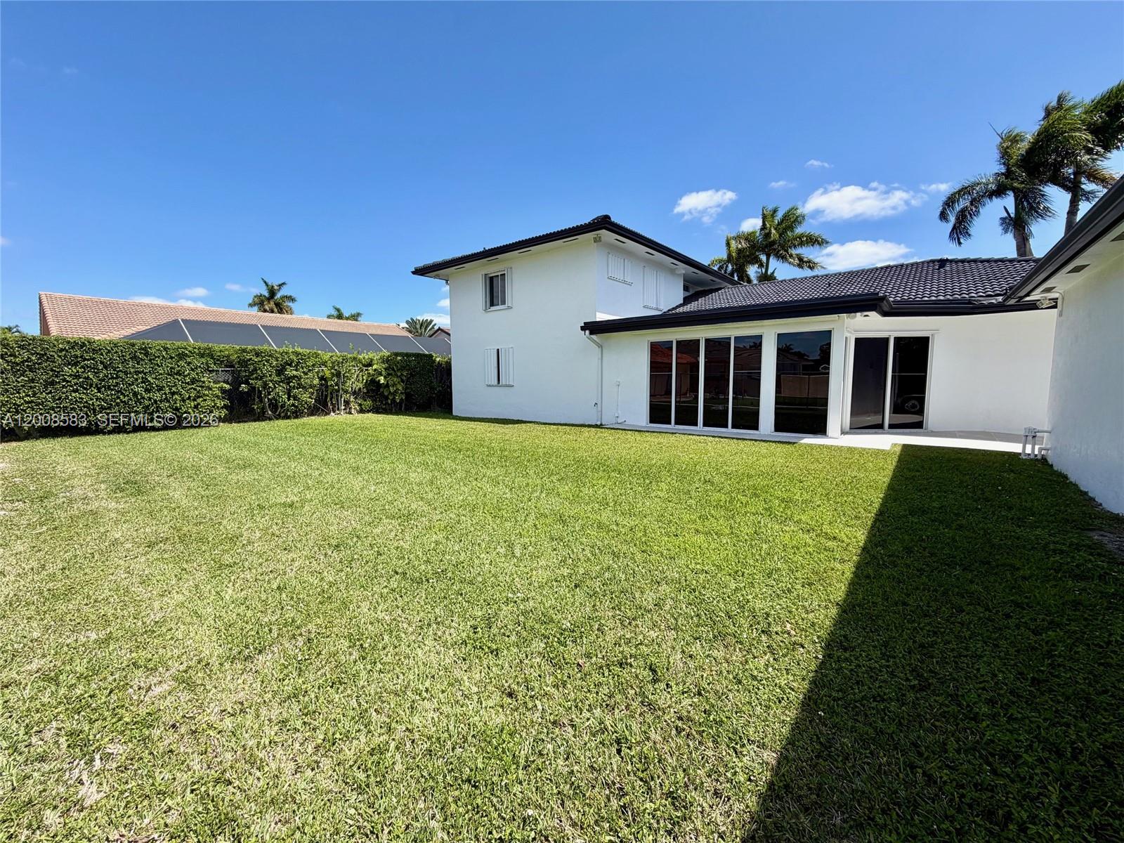 13431 Southwest 32nd Street Miami, FL 33165 - Photo 67 of 77 a view of a house with a yard