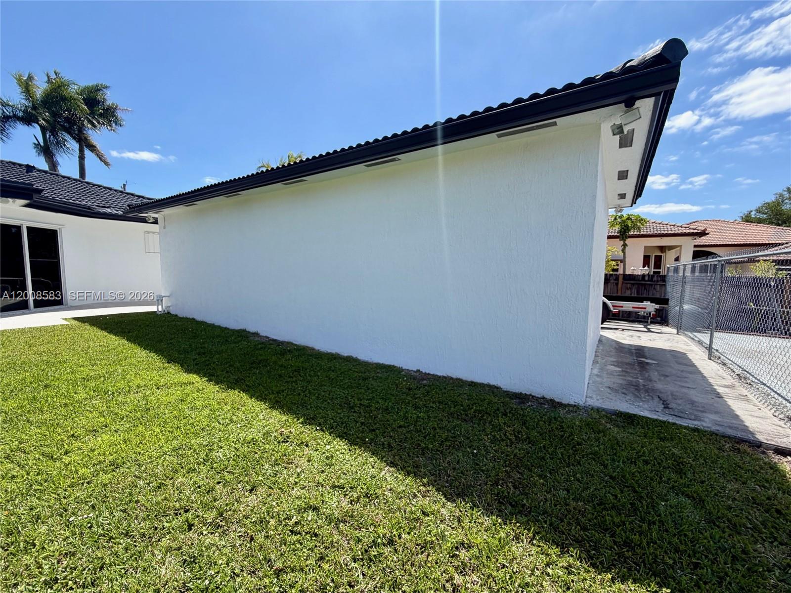 13431 Southwest 32nd Street Miami, FL 33165 - Photo 68 of 77 a view of a backyard with plants and a patio