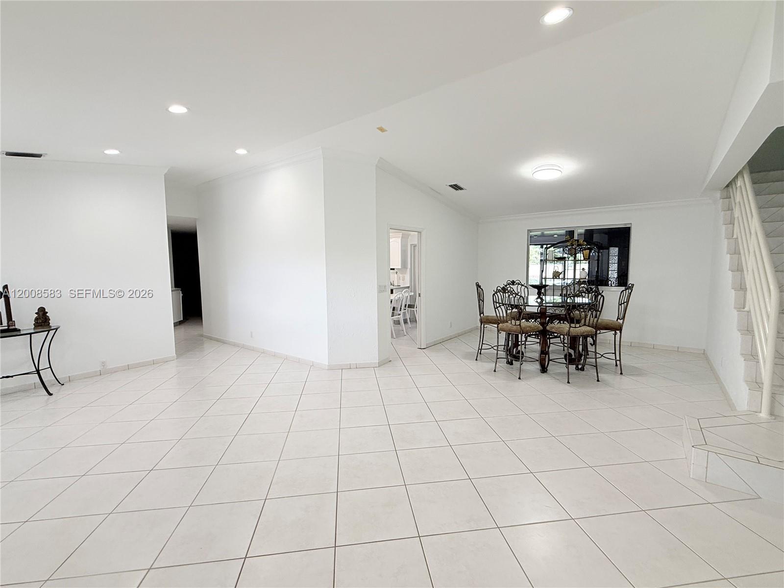 13431 Southwest 32nd Street Miami, FL 33165 - Photo 7 of 77 a view of a livingroom with furniture and a workspace