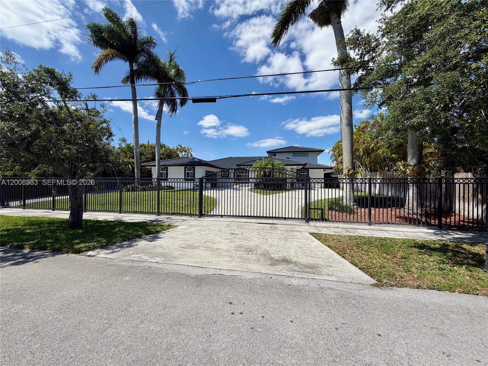 13431 Southwest 32nd Street Miami, FL 33165 - Photo 74 of 77 Main driveway and gate