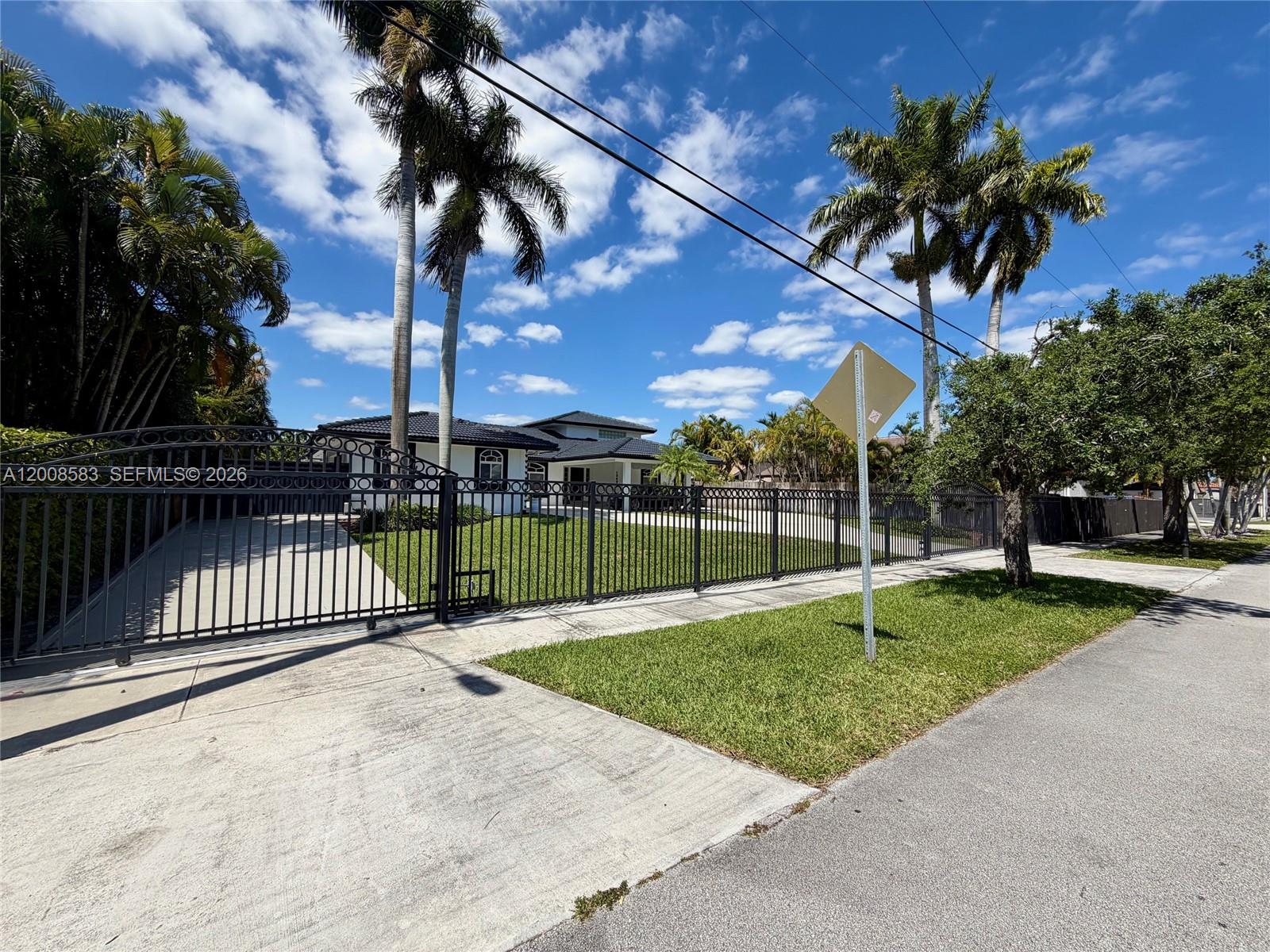 13431 Southwest 32nd Street Miami, FL 33165 - Photo 75 of 77 Left driveway and side gate