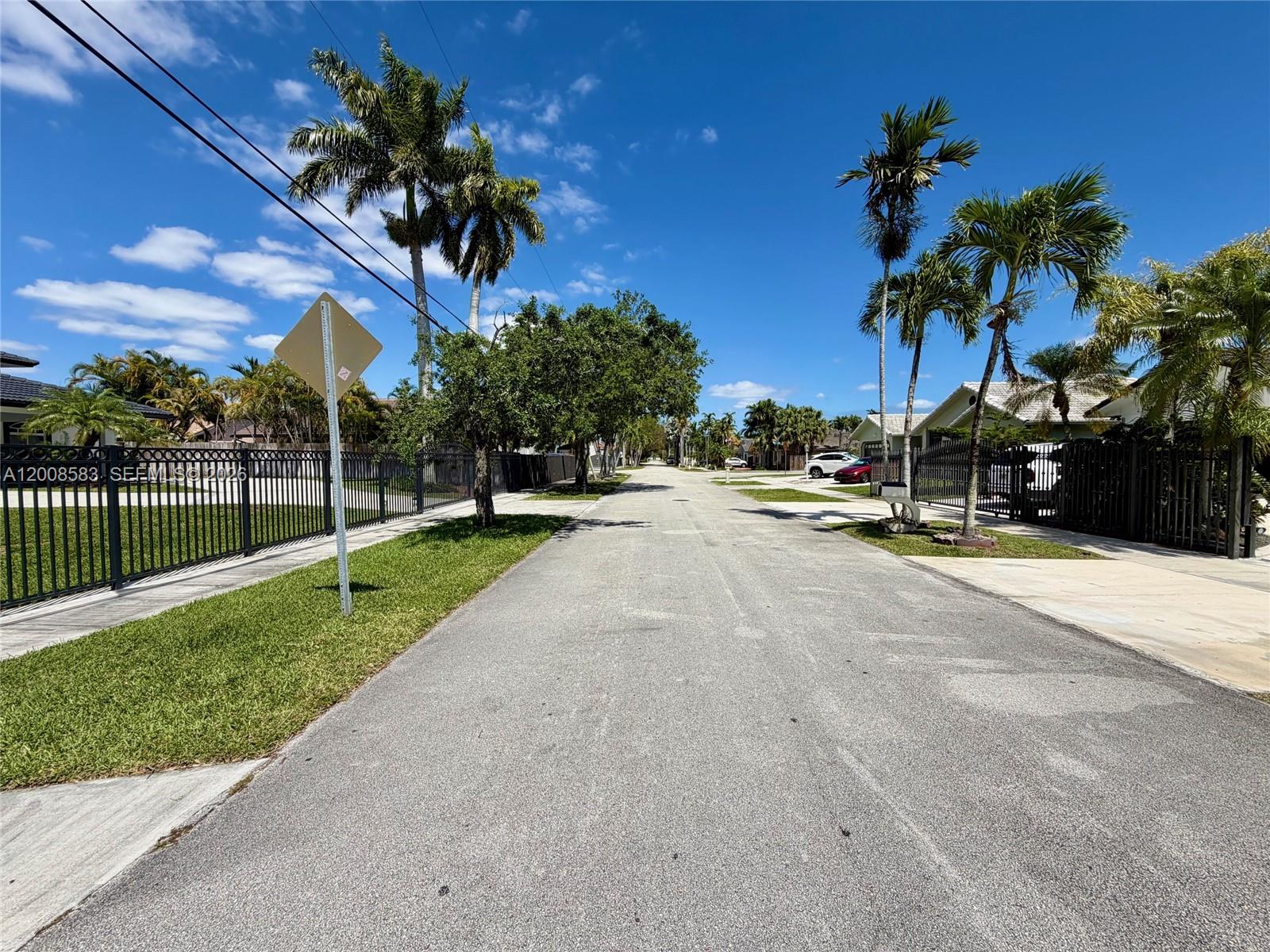 13431 Southwest 32nd Street Miami, FL 33165 - Photo 76 of 77 a view of a park with palm trees