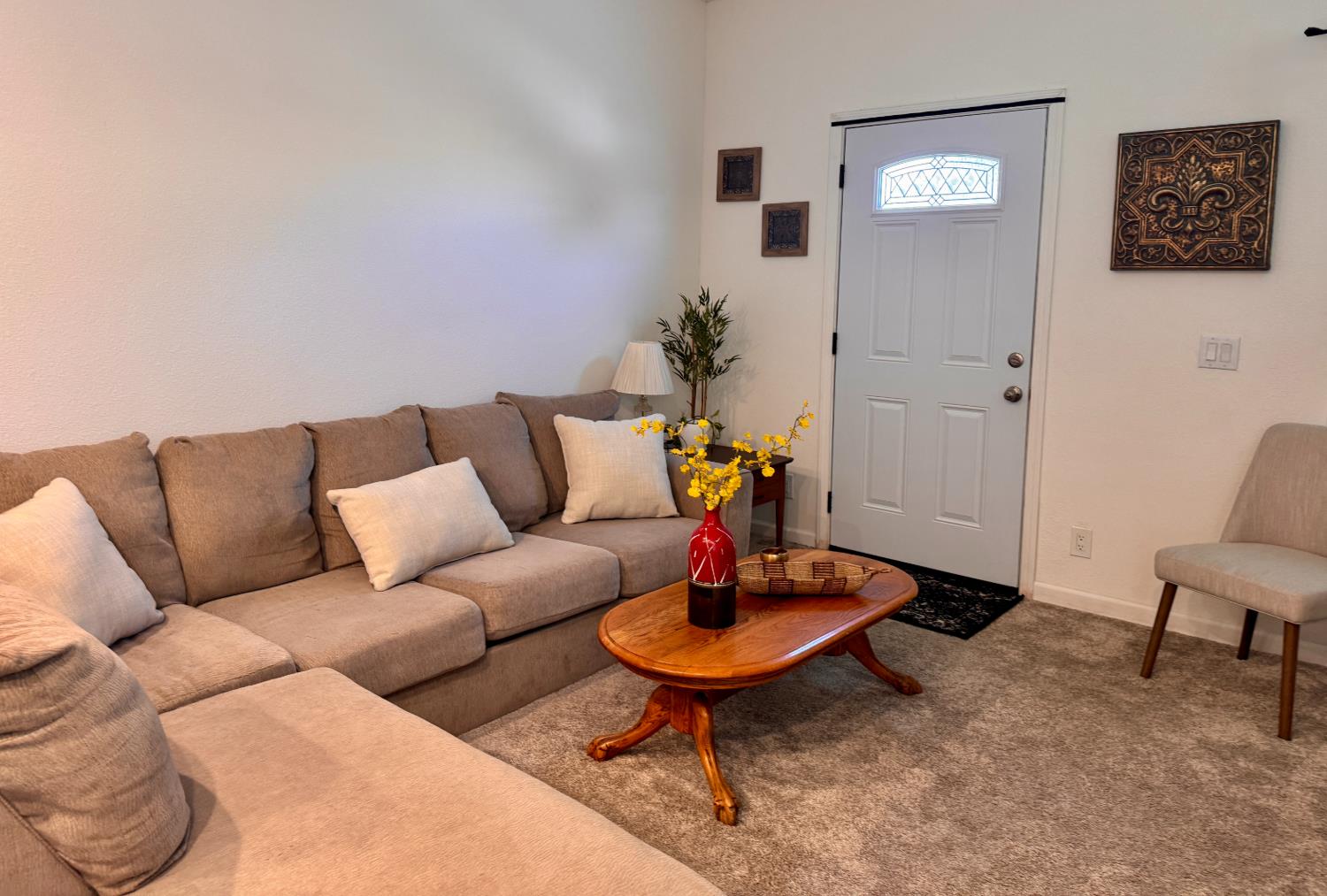 360 East Grant Line Road, Unit 16 Tracy, CA 95376 - Photo 6 of 36 Entryway featuring a white paneled door with decorative glass insert, complemented by neutral carpeting and light-toned walls