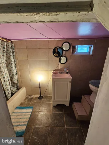 a bathroom with a toilet and a sink