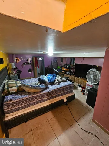 a bedroom with bed and window