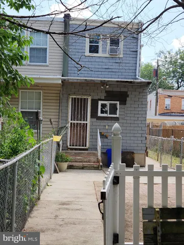 a balcony with wooden floor and fence