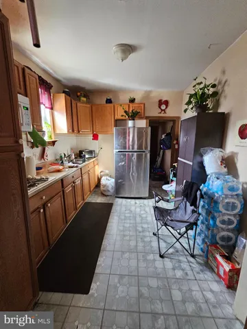 a kitchen with a sink and a stove top oven