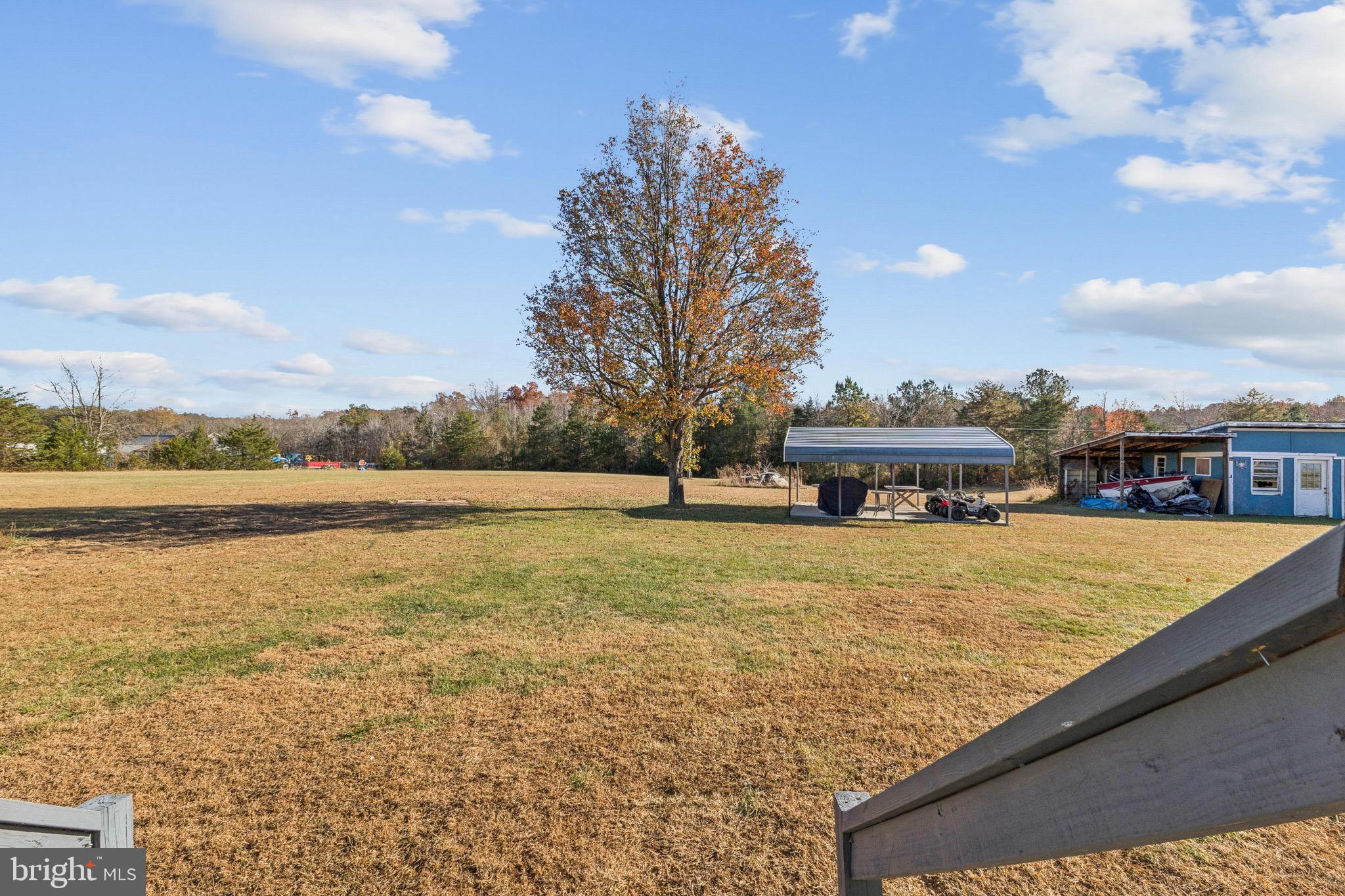10237 Hook Road Rapidan, VA 22733 - Photo 17 of 37 a view of a lake with a building in the background