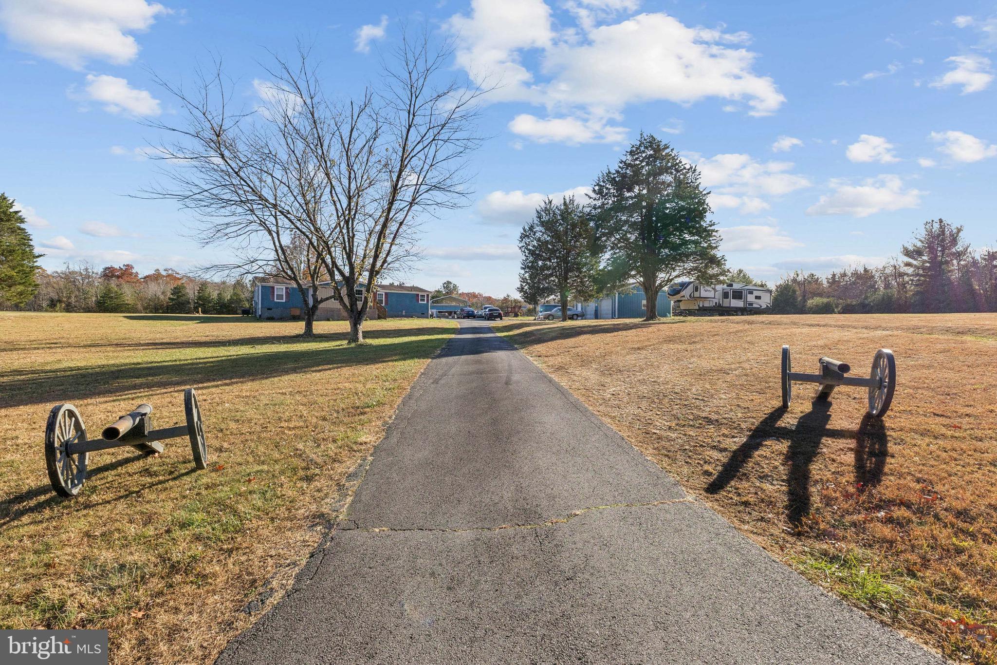 10237 Hook Road Rapidan, VA 22733 - Photo 2 of 37 a view of swimming pool with outdoor seating and lake in the back
