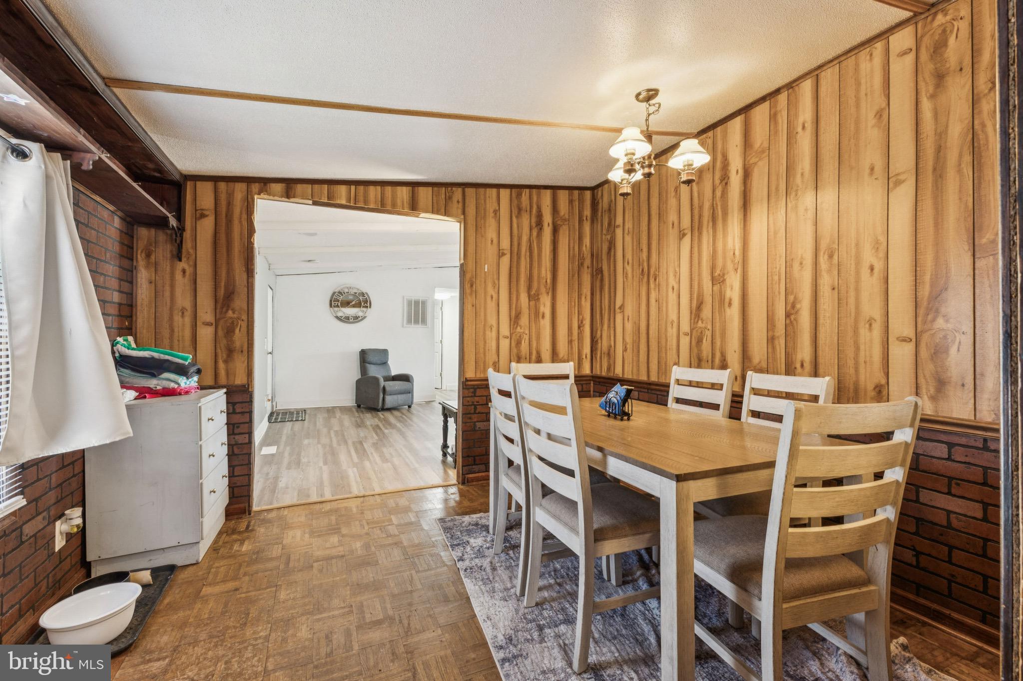 10237 Hook Road Rapidan, VA 22733 - Photo 23 of 37 a view of a dining room with furniture and a chandelier