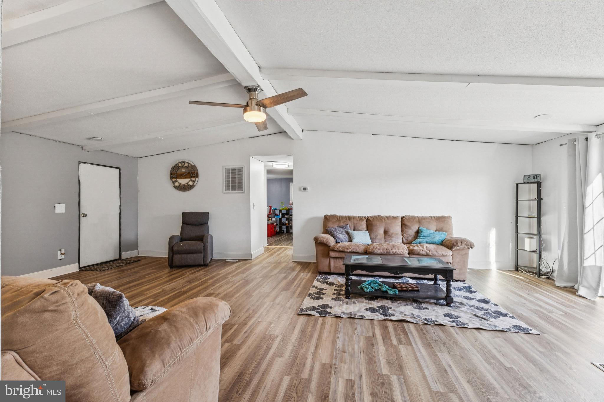 10237 Hook Road Rapidan, VA 22733 - Photo 24 of 37 a living room with furniture and a wooden floor