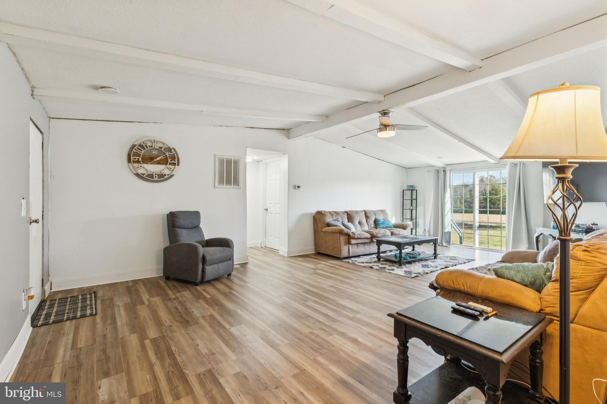 10237 Hook Road Rapidan, VA 22733 - Photo 27 of 37 a living room with furniture and a table