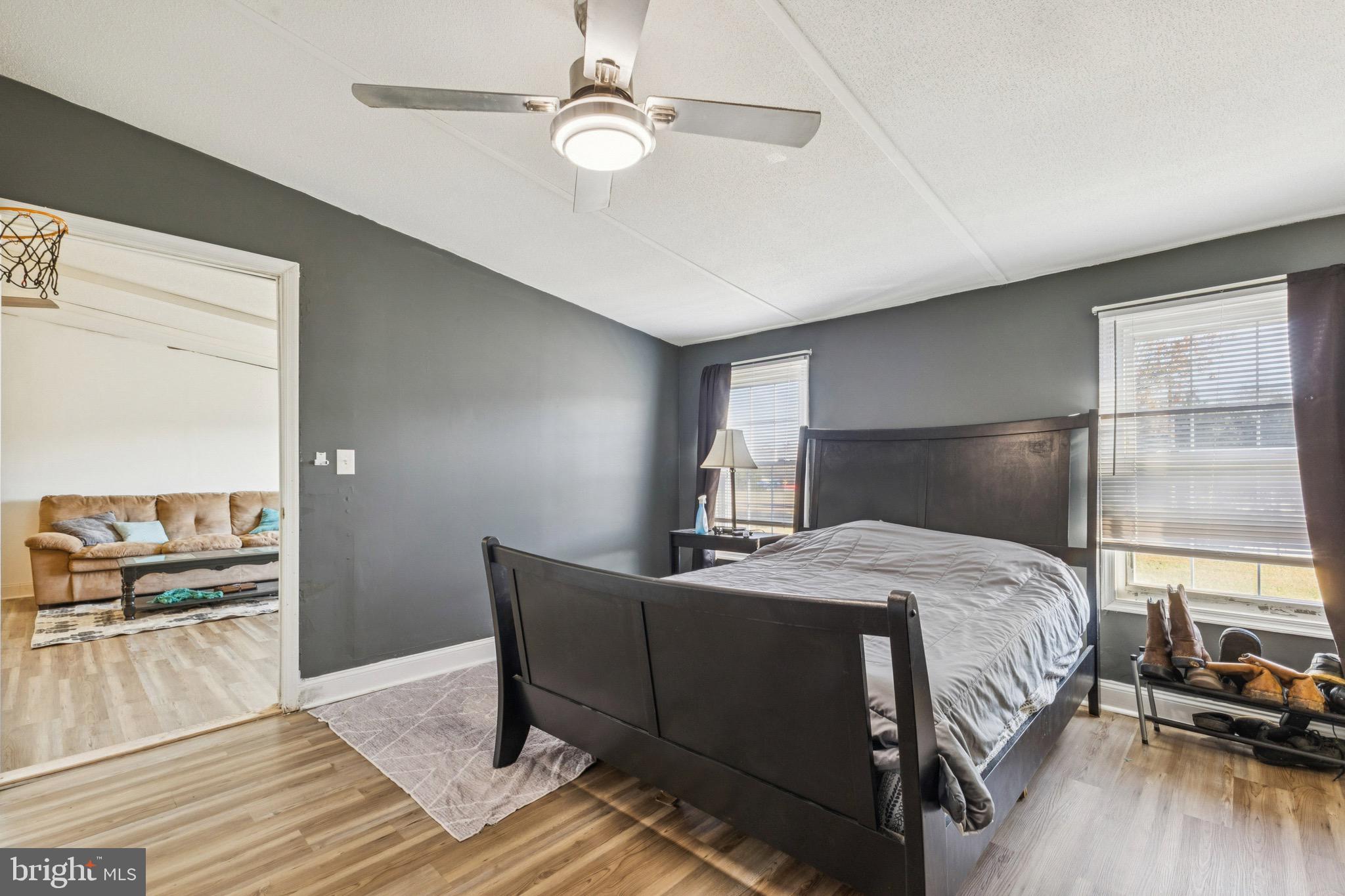 10237 Hook Road Rapidan, VA 22733 - Photo 29 of 37 a bedroom with a bed and wooden floor