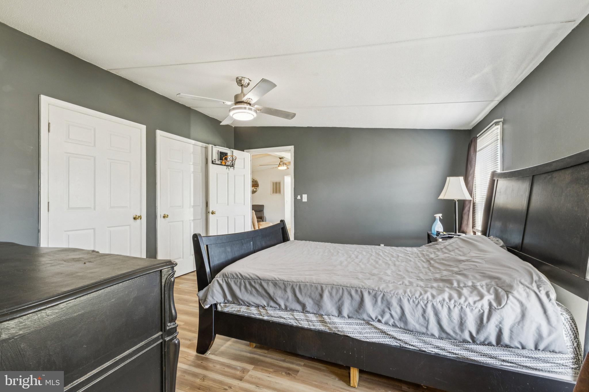 10237 Hook Road Rapidan, VA 22733 - Photo 30 of 37 a bedroom with a bed and a chandelier