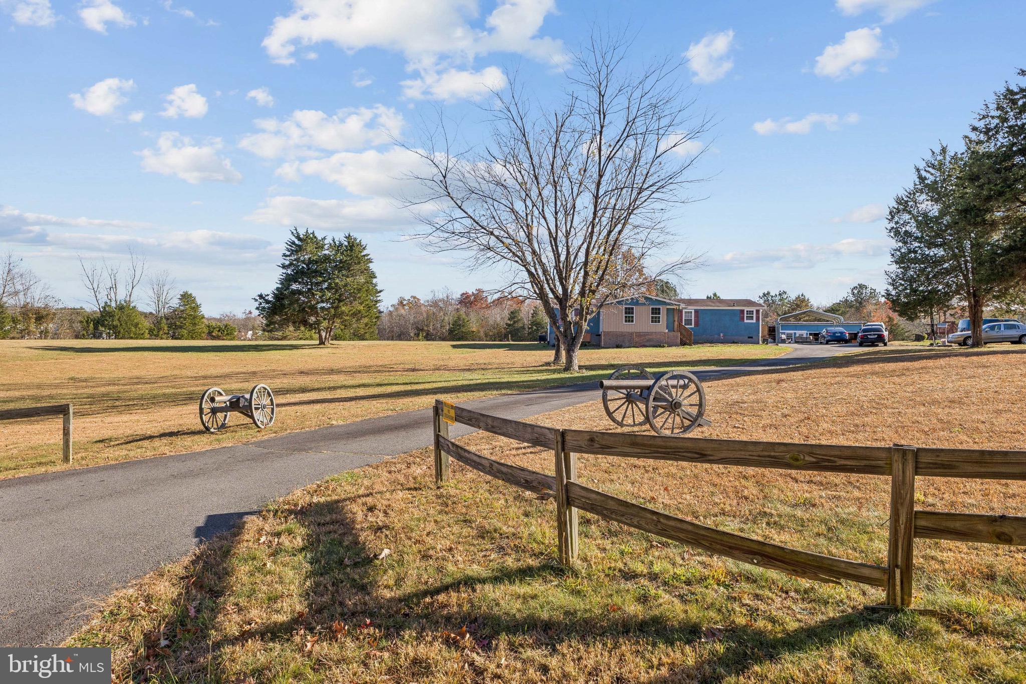 10237 Hook Road Rapidan, VA 22733 - Photo 3 of 37 a view of a street with trees and houses in the background
