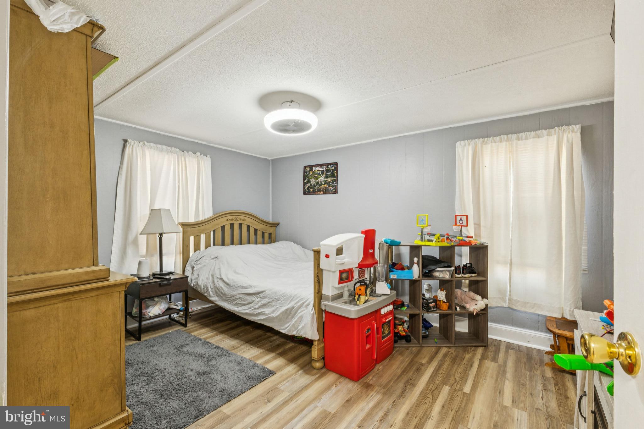 10237 Hook Road Rapidan, VA 22733 - Photo 35 of 37 a bed room with a bed and a chair